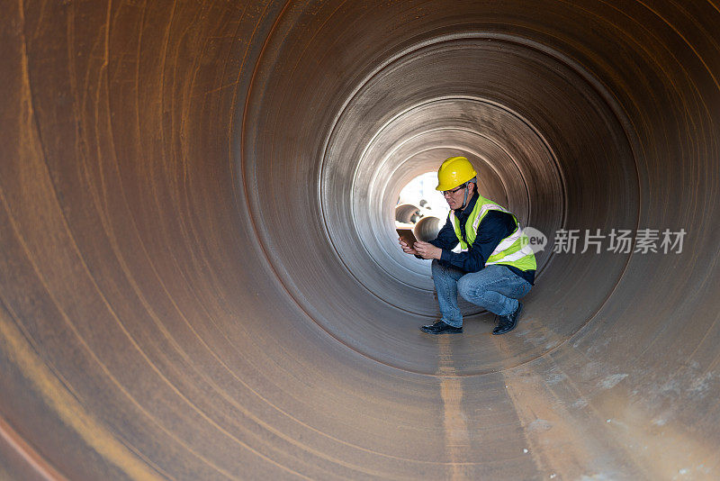 A middle-aged Asian male worker